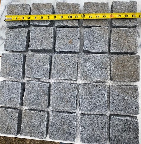 Stormy Granite Cobblestone Pavers - Ideal for driveways, paths and courtyards, these natural surface granite cobbles are non-slip and durable, visit any European city and you will find pavers of a similar material and construction serving their purpose for hundreds of years! Mounted on a plastic mesh for accelerated installation, great for dry or wet setting.