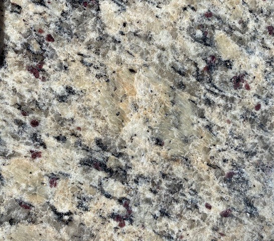 Burnt Sienna Raj - This granite gracefully mixes a warm white and grey background with black veining and burnt sienna fleck accent features.