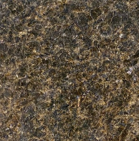 Warm Silvershine Brown - This warm brown granite features golden tightly veined pattern with shiny silver specks peppered throughout.
