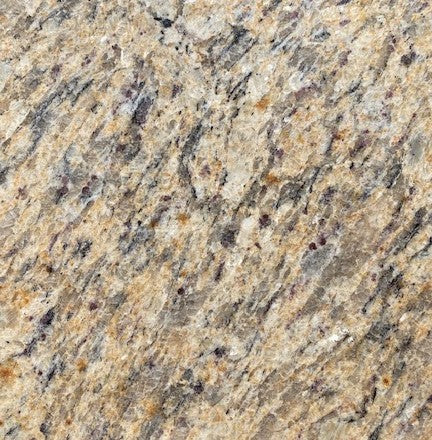 Mottled Brazilian - This mottled granite features a warm background with flecks of white and orange and black and gray veining throughout reminiscent of shades of Brazil.