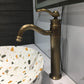 Brushed Single Handle Faucet:  Curved faucet / Single handle faucet / Clear crystal cap detail / Brushed Brass