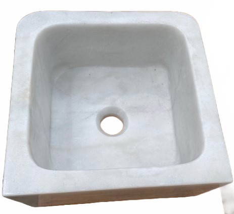 Small Marble Sink: This small white marble sink is carved out from one marble piece and features gray veining. It's perfect for a bathroom or other small space area.