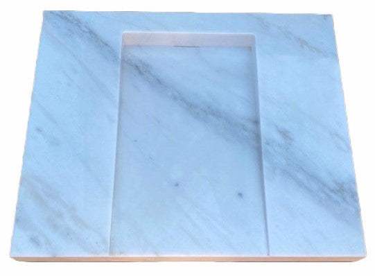 Marble Hidden Drain Sink: This exquisite marble sink is carved from one piece of solid white marble and features gray veining throughout. It is a simple, yet sophisticated design that is meant to look as if it's floating wherever placed. The hidden drain provides a modern, clean feel. It's rectangular shape works well with any decor set up.